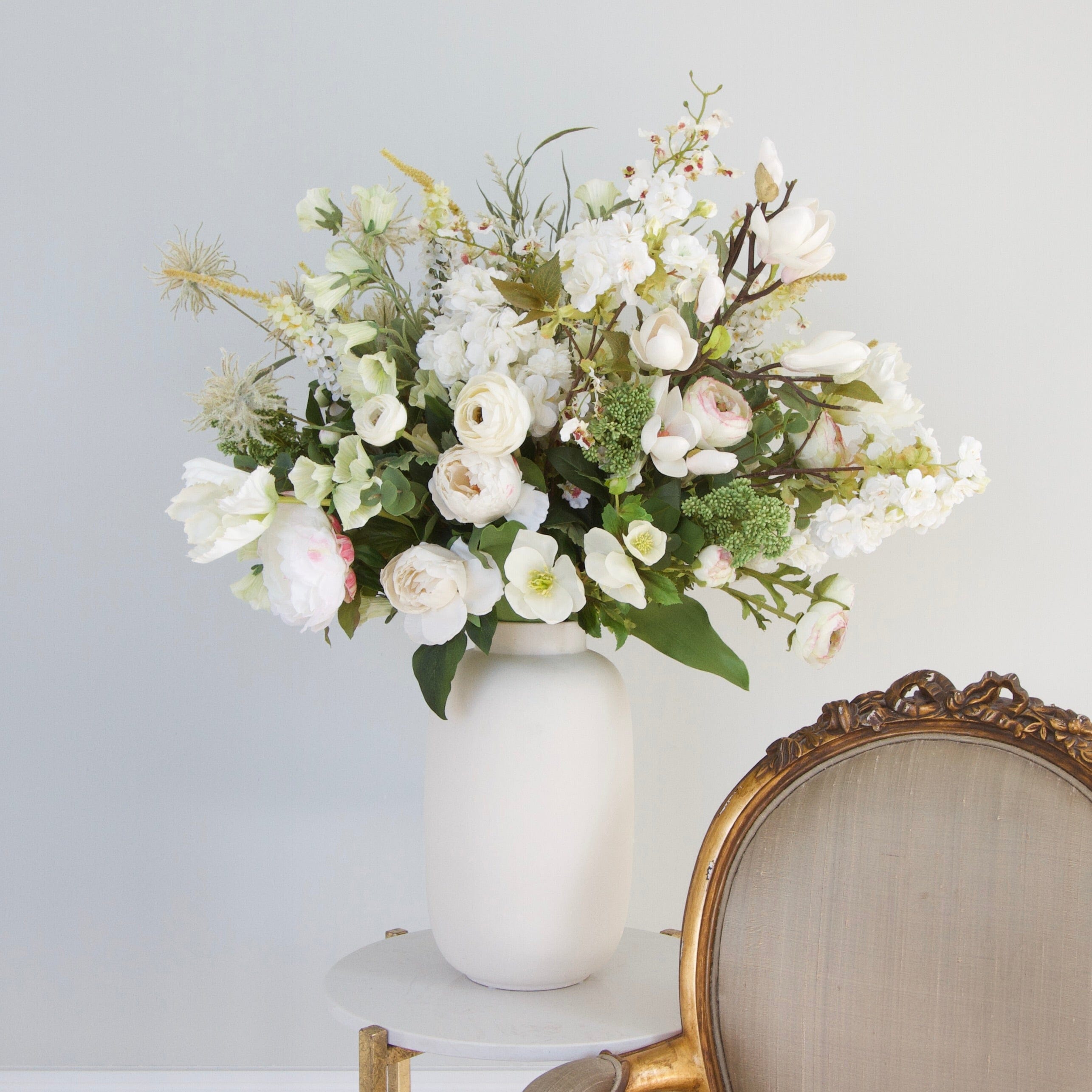 artificial flowers in large vase