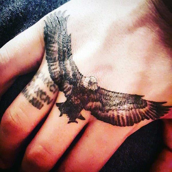 eagle tattoo on hand boy