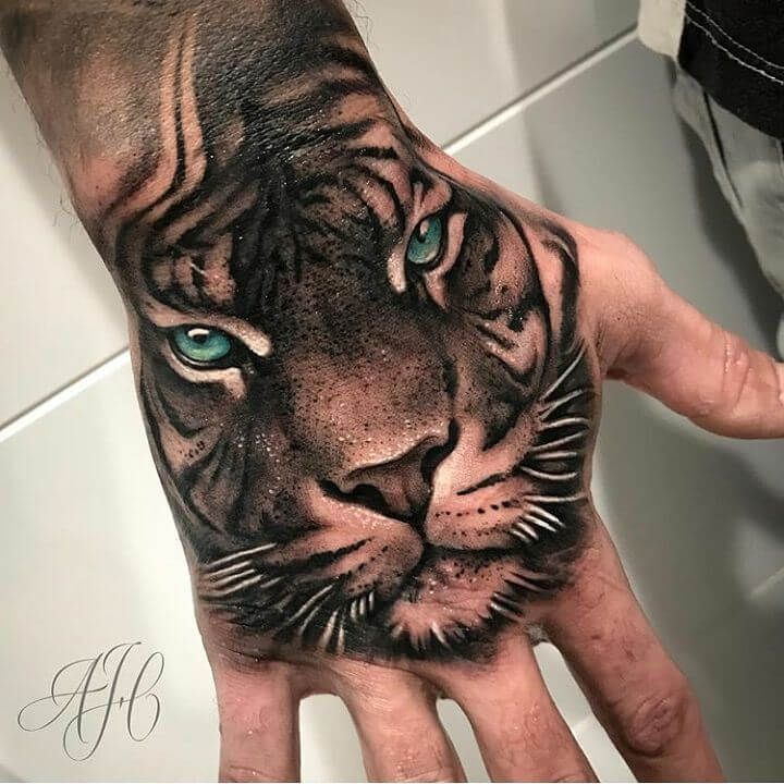 tiger face tattoo on hand