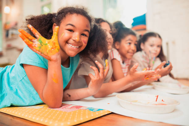 four girls finger painting