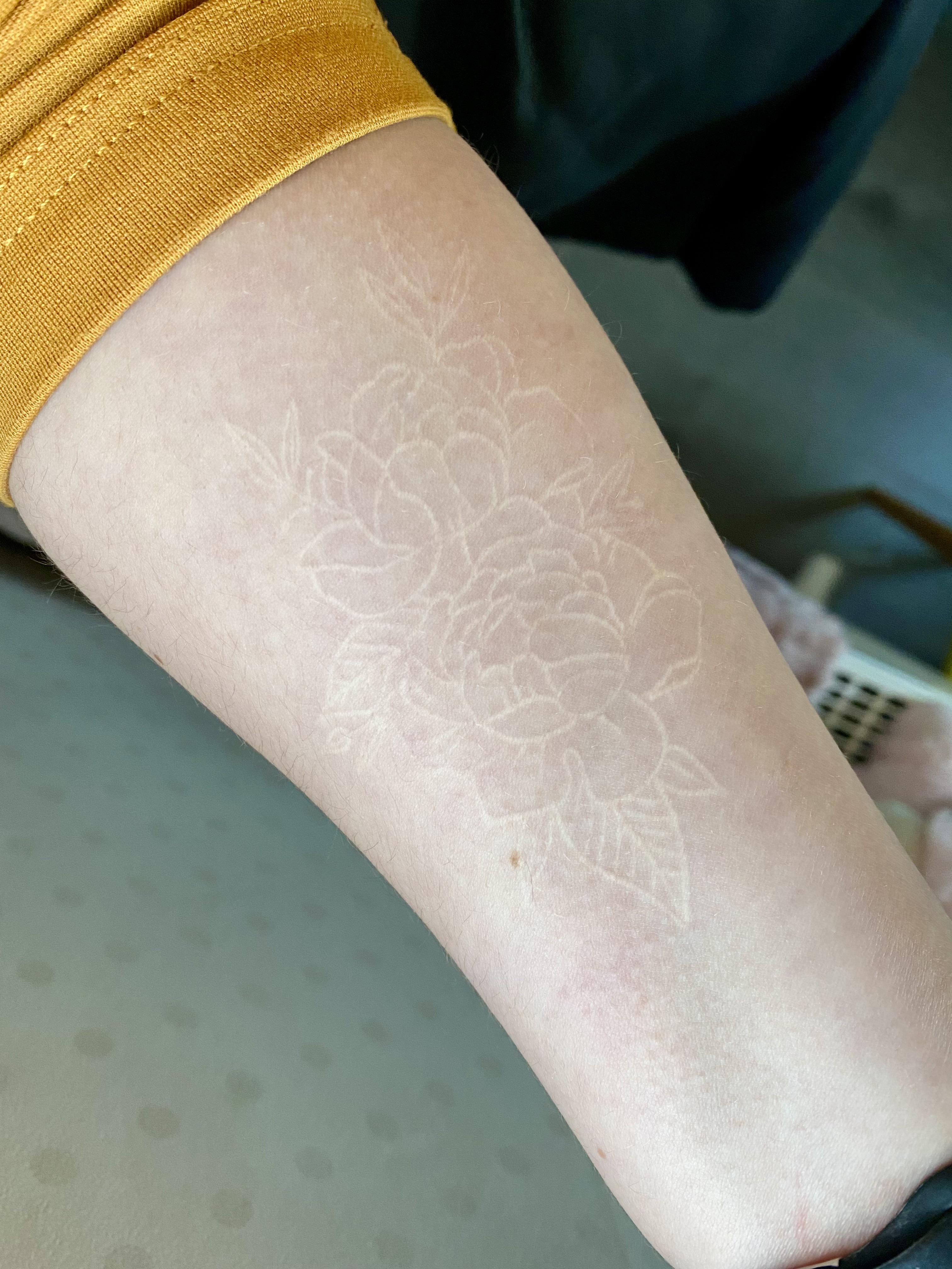 aged badly white ink tattoo