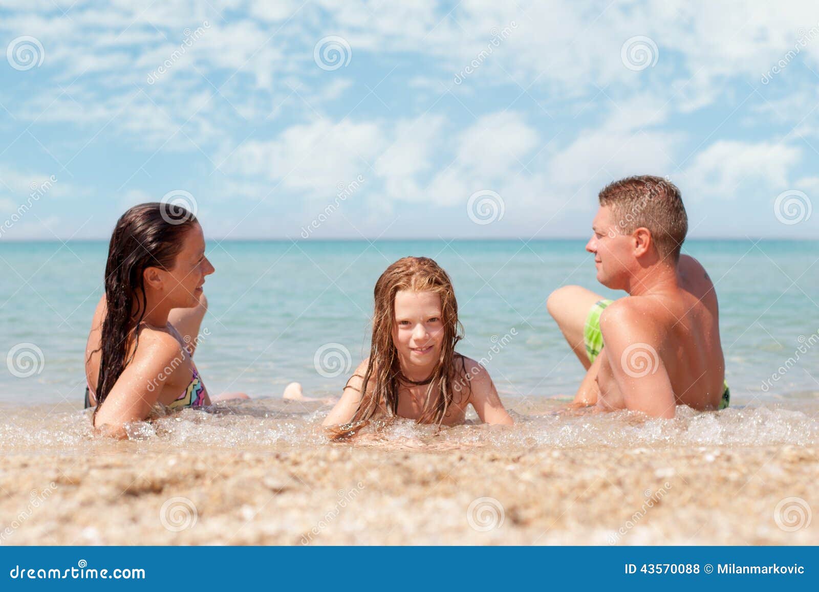 family naked at the beach