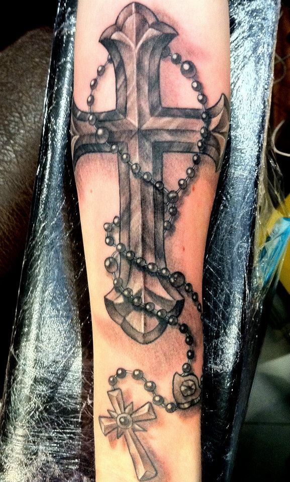 tattoo with rosary beads and cross