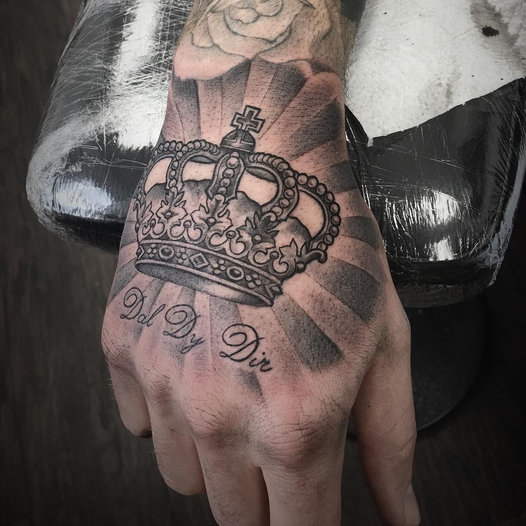 crown tattoo on hand