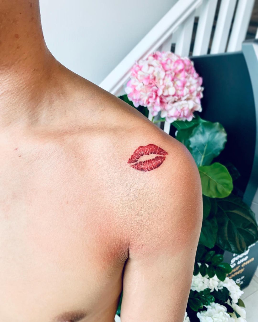 kiss mark tattoo