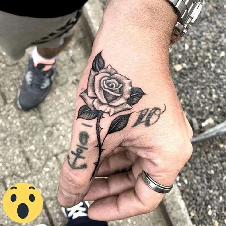 rose tattoo on hand