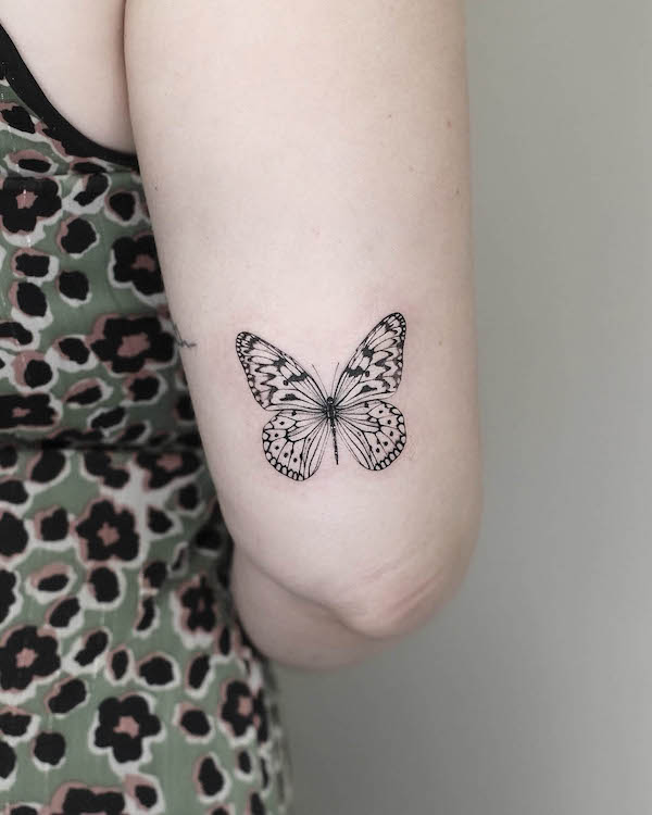 butterfly tattoo on back of elbow