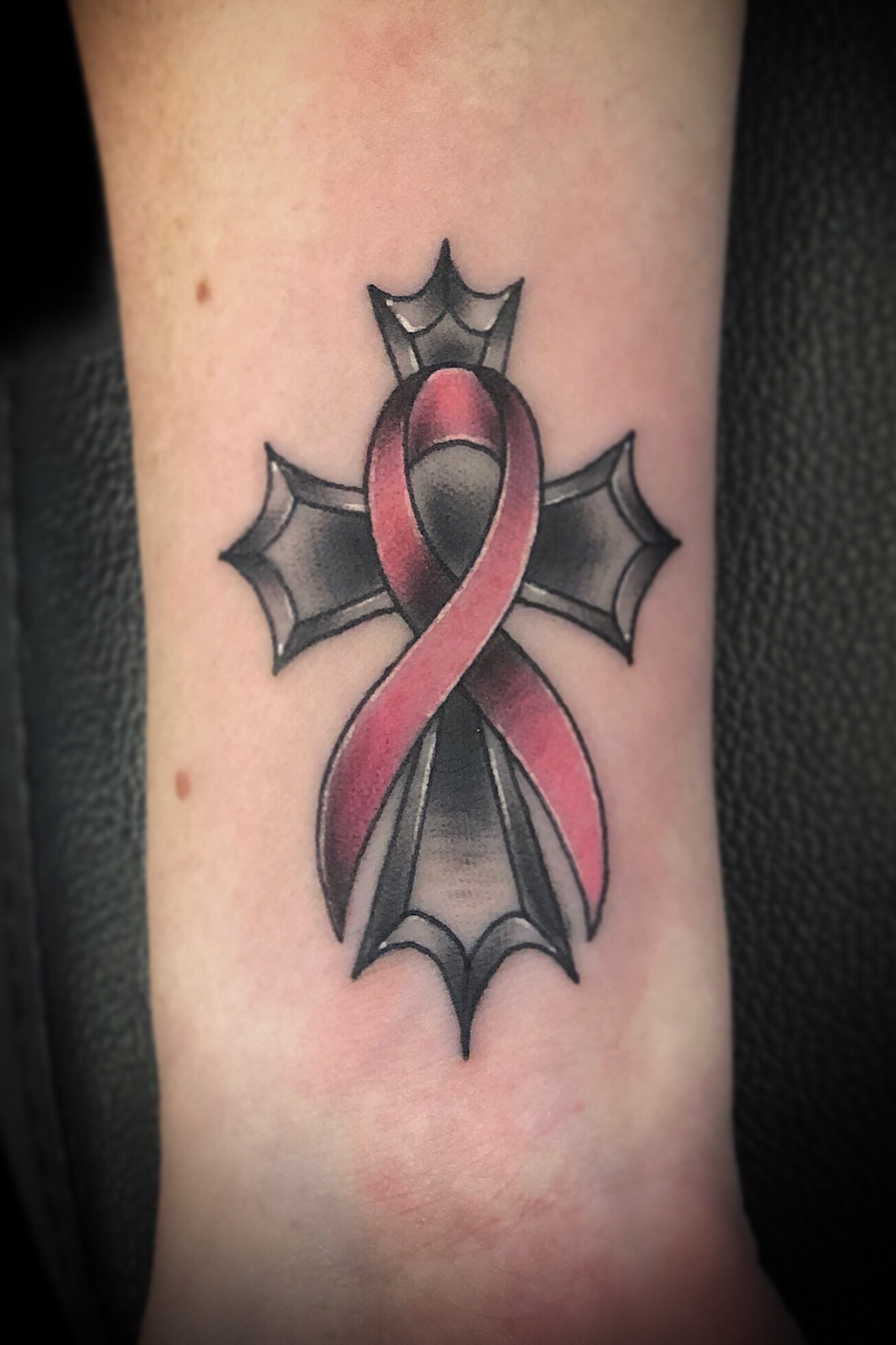 ribbon and cross tattoo