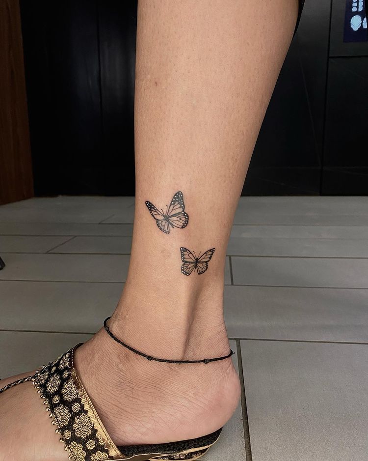 small butterfly tattoos on foot