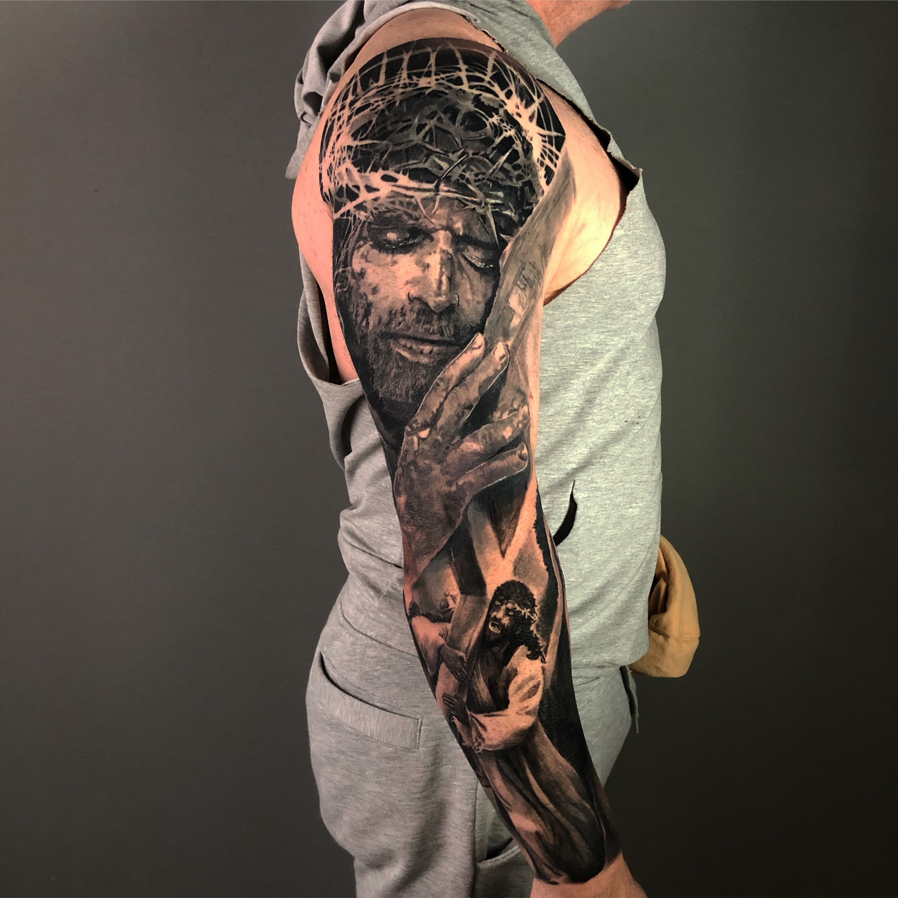 jesus arm sleeve tattoo