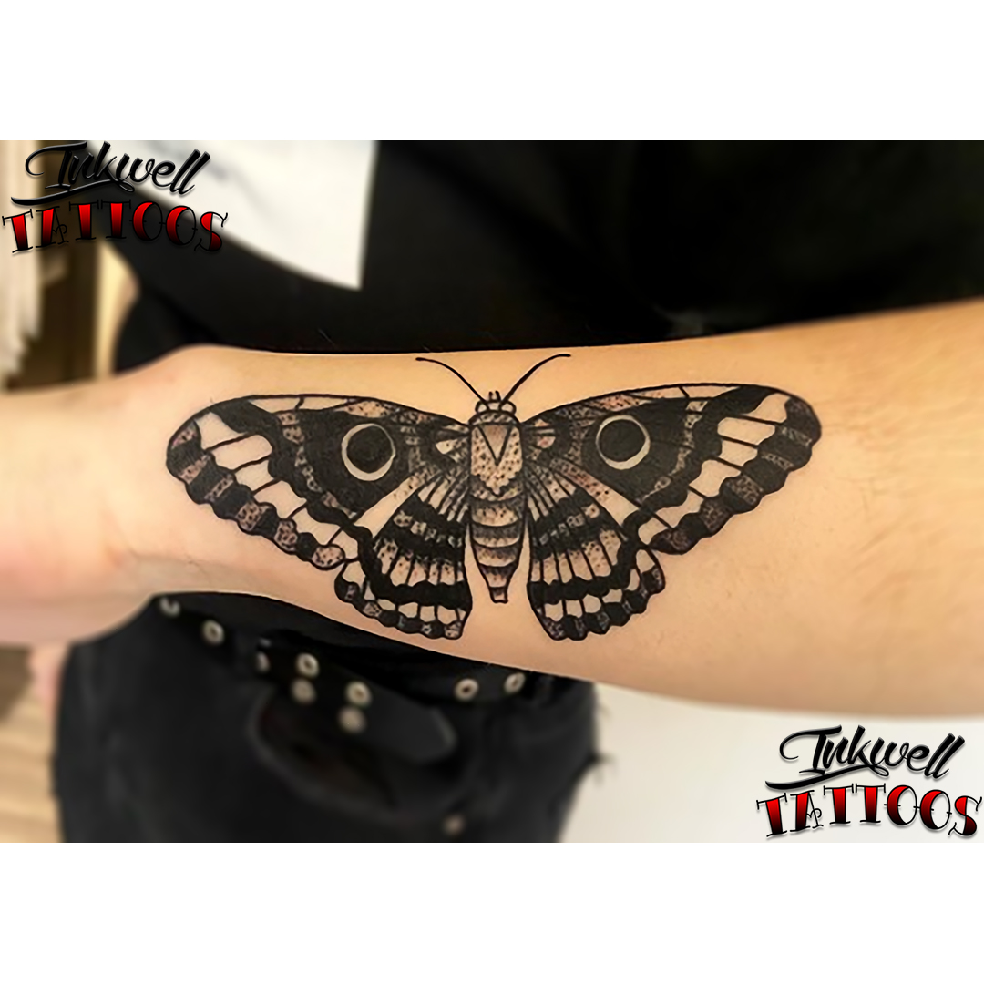 moth tattoo arm