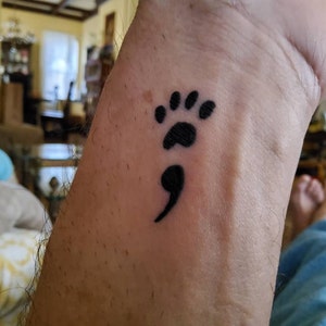 paw print semicolon tattoo