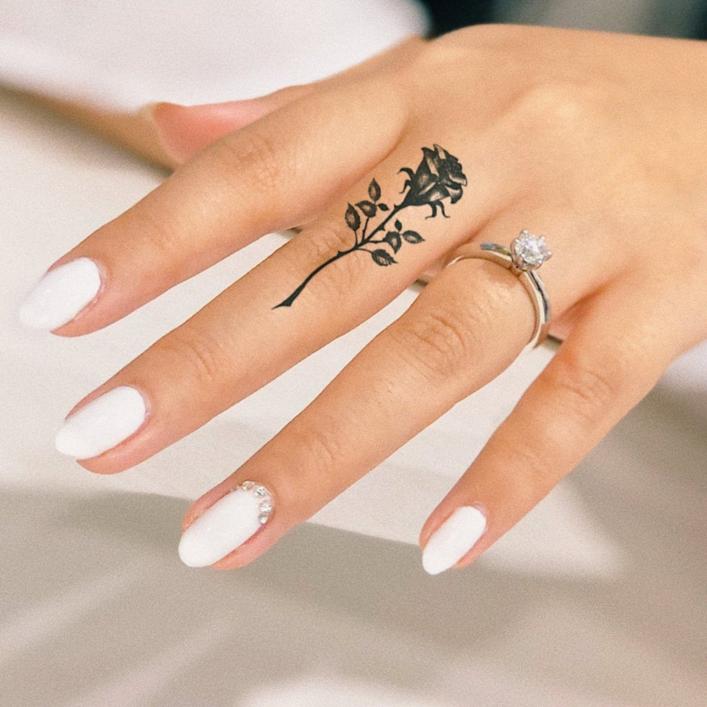 rose finger tattoo