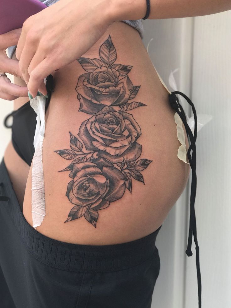 tattoo of roses on thigh