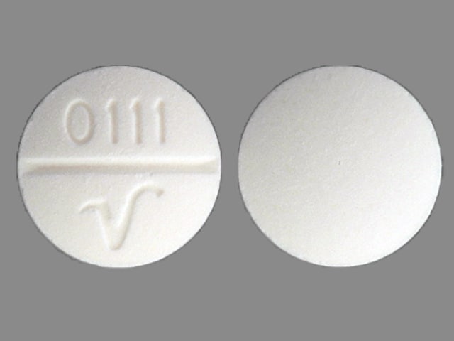 v white round pill